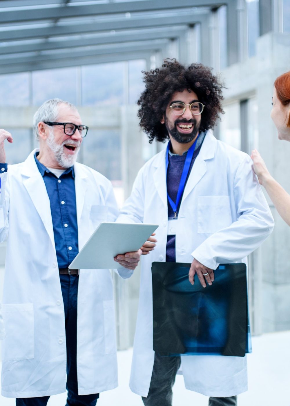 Group of doctors standing on conference, medical team laughing. Group of doctors standing on conference, medical team laughing when discussing issues.
